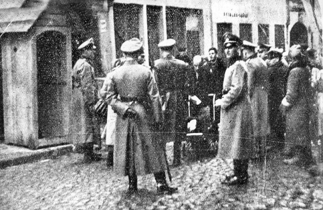 German officers inspecting documents at one of the gates in the Vilna ghetto